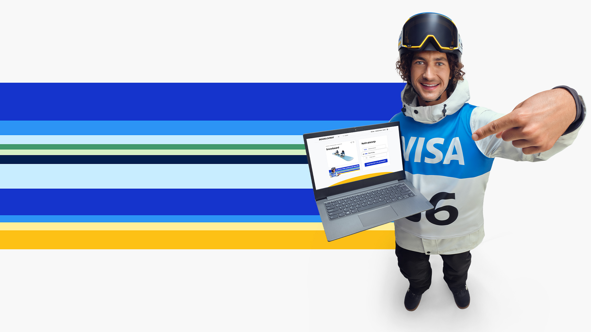 athlete holding laptop with olympic stripes